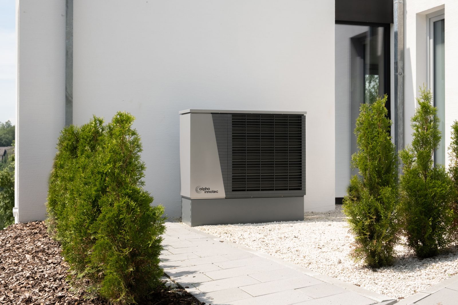 permis pompe à chaleur Wallonie unité extérieure installée le long d'une maison